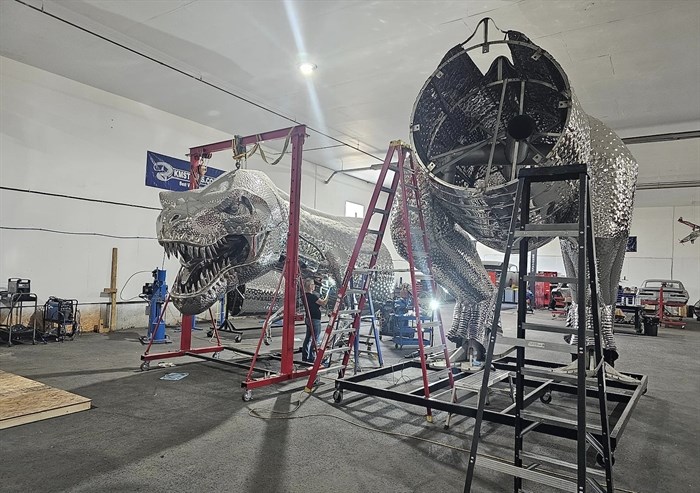 Two segments of the T-Rex sculpture are seen suspended in Kevin Stone's shop in this undated photo.