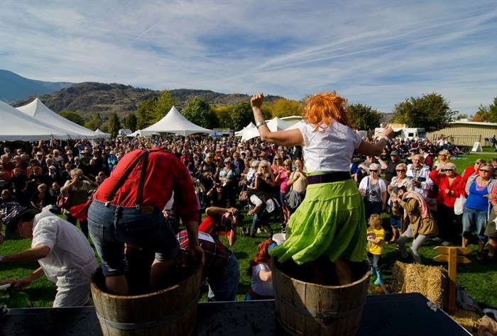 Competitors stomping grapes at the Festival of the Grape in Oliver in an undated photo. 