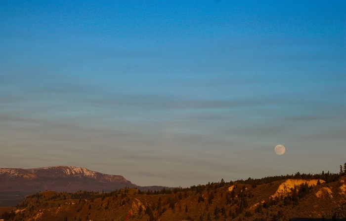 The full Pink Moon shines through some local wildfire smoke in Kamloops. 