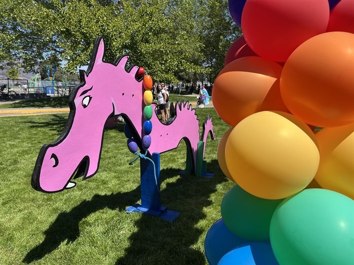 Ogopogo clad in pink and ready to pose for pictures at Kelowna's Pride Festival. 