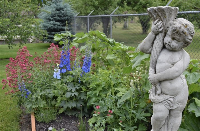 A sculpture in a flower bed at one of the participating homes. 