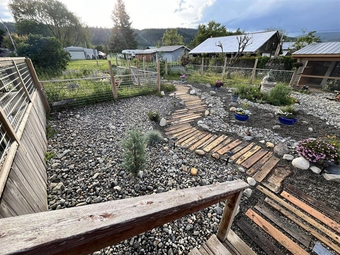 Rocks, drought resistant plants and a repurposed walkway are found in a Heffley Creek yard.