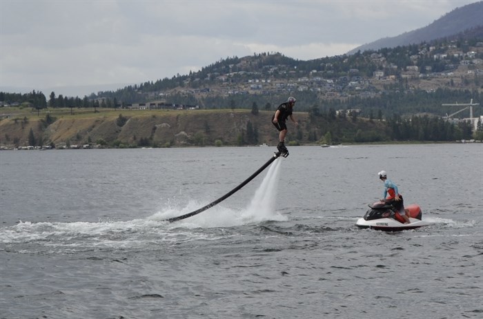 Someone up in the air above Okanagan Lake on a flyboard on Canada Day 2024. 