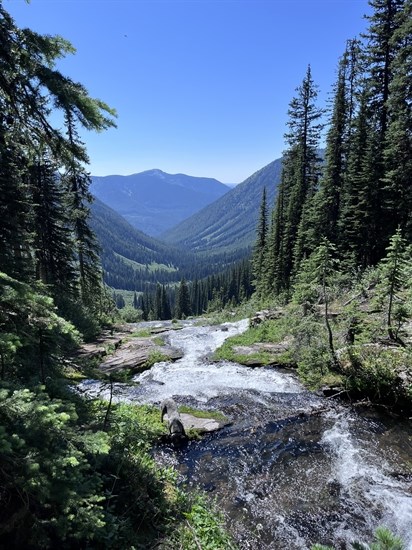 A waterfall and mountain view can be seen from Pinnacle Lake Trail. 