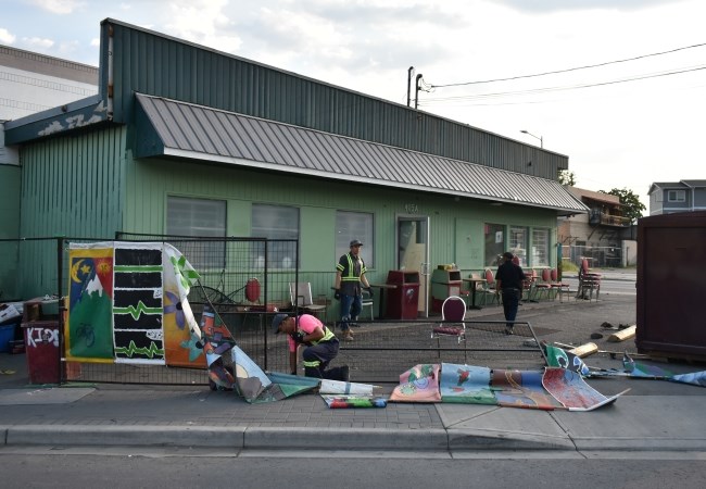 Locksmith Ray Dhaliwal assisted bailiffs at The Loop, while workers loaded up The Loop's fencing during the Aug. 3, 2024, eviction.