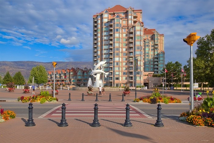 People stroll through downtown Kelowna on an early morning in August. 