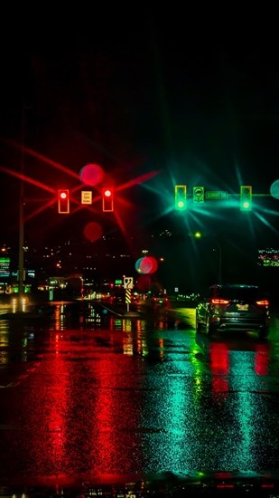 Lights against wet city streets in Kamloops shine bright after a rain shower in September. 