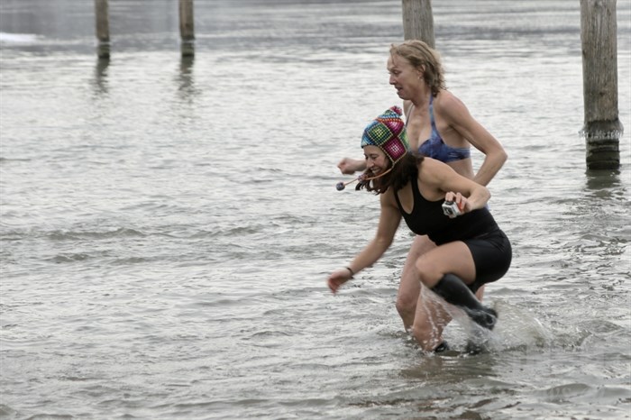 The rush to get out of the frigid waters of the South Thompson River at the Kamloops Polar Bear Swim, Thursday, Jan. 1, 2015.