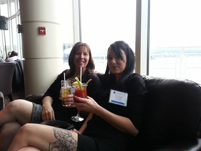 Mel and Brittany of Mel's Pizza at the Pan Pacific Hotel in Vancouver celebrating their win, Thursday, Feb. 26, 2015. The business won the Best Workplace award at the B.C. Small Business Awards.