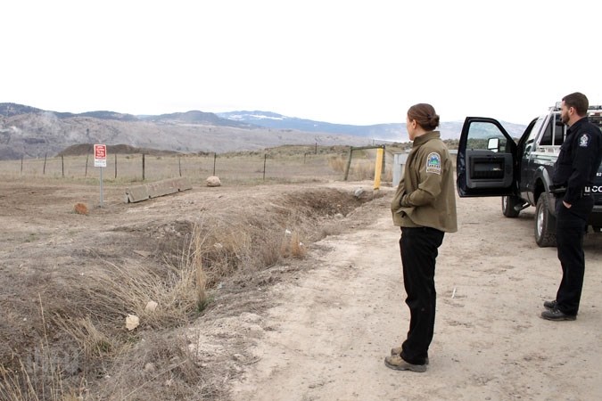 Amanda Weber-Roy and Rob Armstrong survey the area where someone on an ATV ignored several barriers to protect the grasslands. But that's not the only problem in the park 