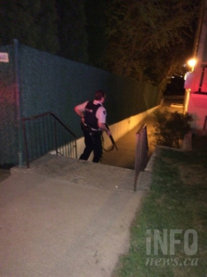 Officers swarm the Uplands Apartment complex Thursday, April 9.