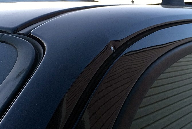 A dent between the door and roof of the truck is the only sign of forced entry.