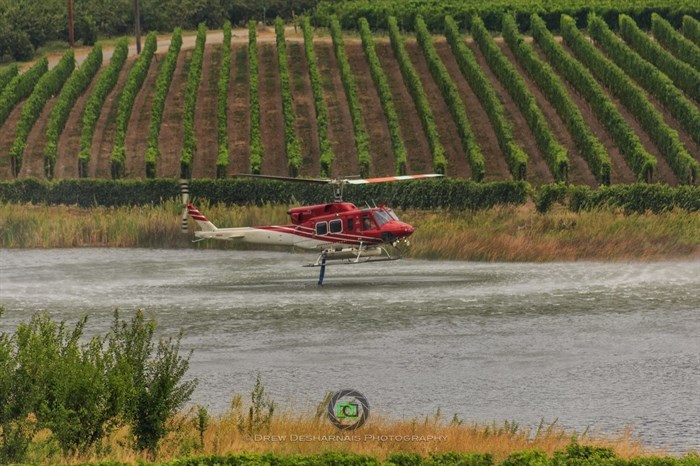 A helicopter snorkling in Oliver, Saturday, Aug. 16, 2015.