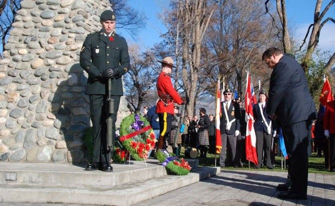 Kamloops Mayor Peter Milobar lays a wreath.