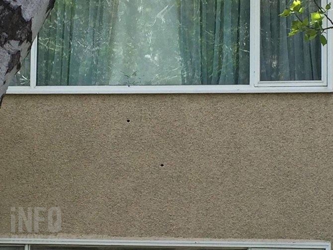 Bullet holes are visible after the house at 1699 Parkcrest Ave. was the target of gun fire Sunday morning, April 24, 2016.	