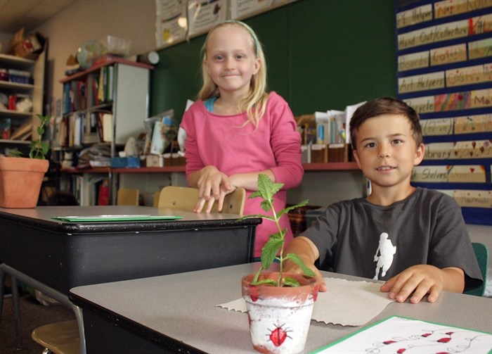  Savanna Beaufield, left, and Evan Hartviksan with their Mother's Day creations.