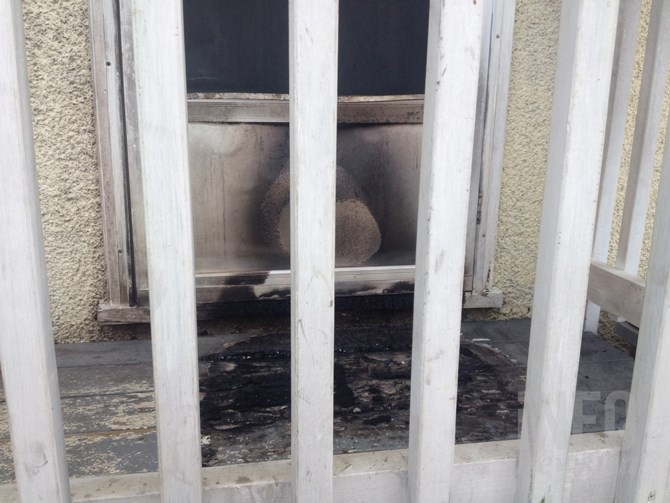 Neighbours quickly doused a fire on the porch of this vacant 10th Street house this week.