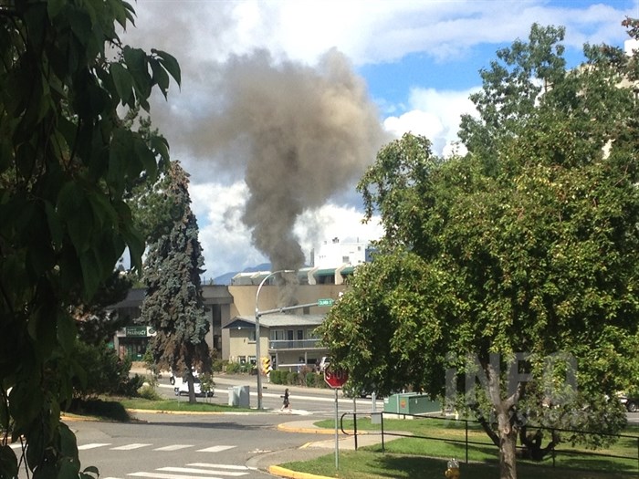 Smoke from a fire at the Travelodge motel in downtown Kamloops on Columbia Street and 4 Avenue can be seen, Wednesday, Aug. 10, 2016.