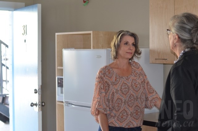 Apartment manager Shelley Kiefiuk in one of the soon to be finished rental units. 