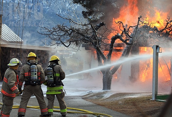 Kaleden firefighters battle a garage fire on Lakehill Road in Kaleden, Friday, Feb. 24, 2017.