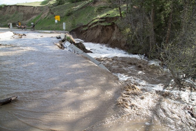 Further upstream at Greenstone Road, Cherry Creek knocked out cement barriers. 