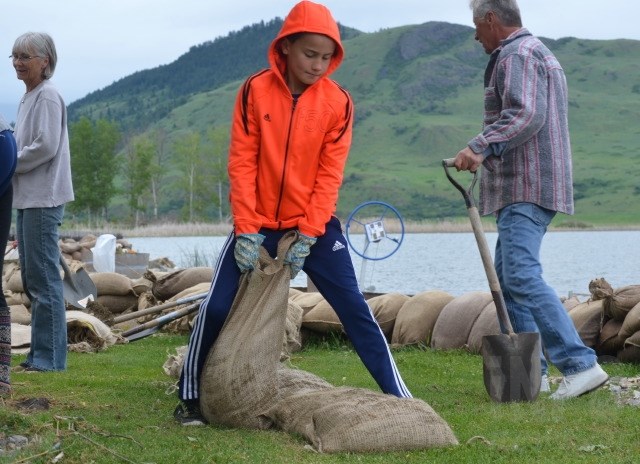 James Tolpinrue, 10, helps sandbag. 