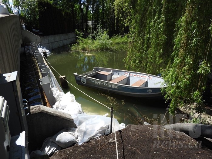 A provincially-funded $24,000 temporary dam has been installed in the Green Bay canal in West Kelowna in order to pump water out and reduce water levels threatening surrounding homes.