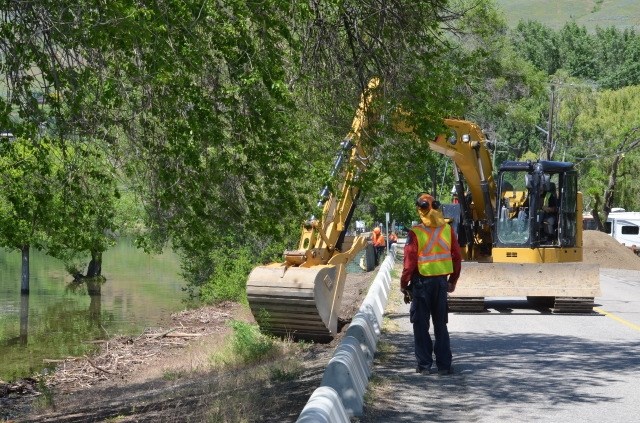 Crews fill gabions with sand on Lakeshore Road, June 2, 2017. 