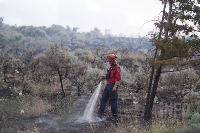 Several B.C. Wildfire firefighters were keeping an eye on hot spots on the evening of June 27, 2017. 