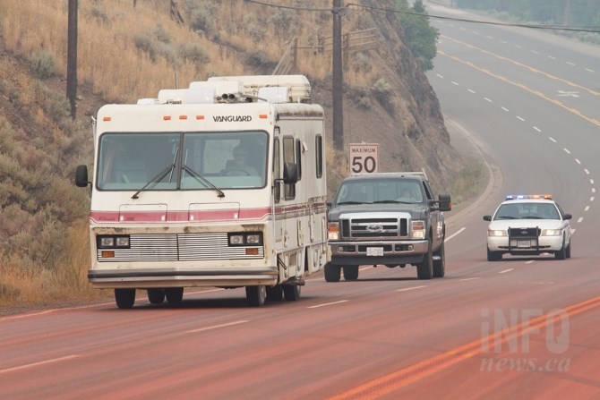 A few vehicles drove through Cache Creek with police escorts close behind. 