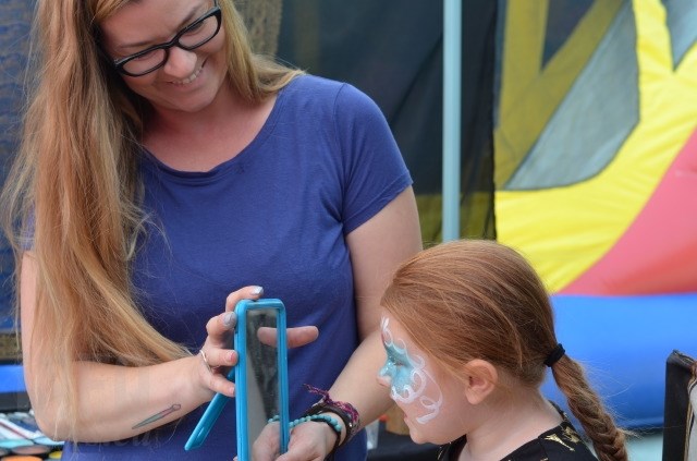 Christine Turpin works her magic on Mikayla Leseque, 4, from Lloydminster, Alberta. 