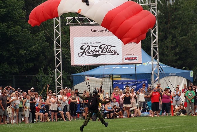 A Skyhawks member runs to a safe landing at Okangan Lake Park on the first day of Peachfest activities, Aug. 9, 2017.