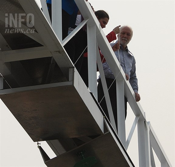 Science Minister Kirsty Duncan attaches the final receiver of the CHIME radio telescope into place on Sept. 7, 2017, while researcher Mark Halpern looks on, at the Dominion Radio Astrophysical Observatory on White Lake Road near Penticton.