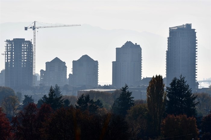 A crane stands beside a building under construction on Kelowna's Sunset Drive.