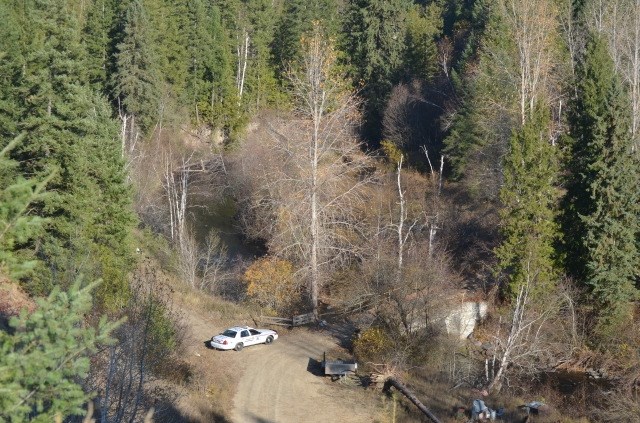 A police car guards the area just past the bridge on Oct. 27, 2017. 