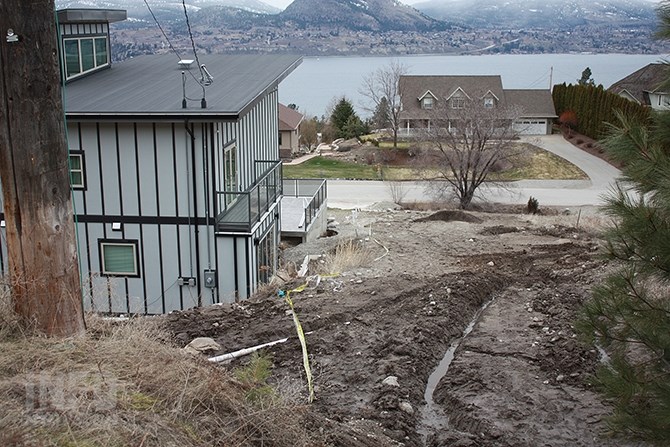 Martin Au-Yeung's Winifred Road property in Naramata suffered some washed out foundation and eroded backyard, but escaped flooding to the interior of the house following last Thursday's downpour.