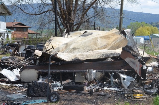 A pile of scorched rubble is all that's left of a trailer on Westside Road. 