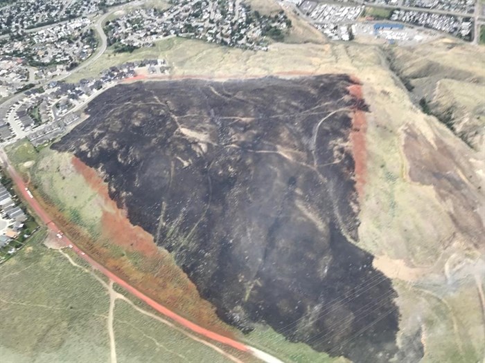 A photo of the Batchelor Heights fire on Thursday, June 21, 2018 showing the fire retardant lines from the air tanker drops. At its peak, the fire was estimated at 60 hectares.