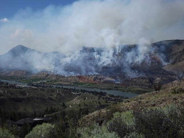 A wide view of the smouldering Shuswap Road fire on July 12, 2018.