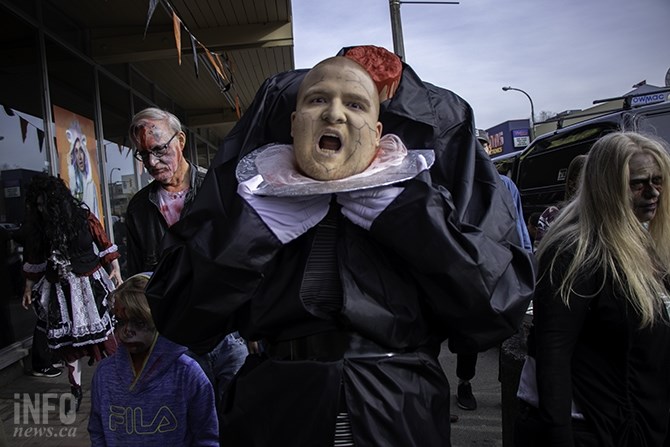 This costume looks like a zombie carrying its head on a silver platter. He was one of the zombies that could be seen dancing outside of the Blendz Coffee on Victoria Street.