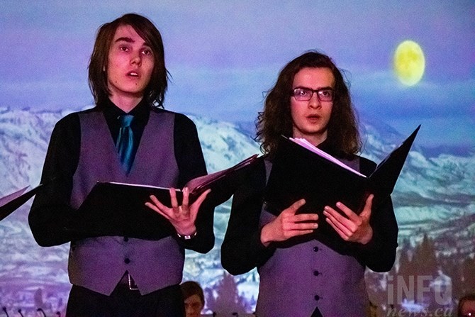 Purple lights shine on Aiden Henderson as he sings with the KSA Secondary Choir. He says before a show he may get anxious, but not uncomfortable. 