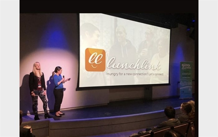 Barbara Chung, right, headed one of the top teams at a tech startup event in Kelowna last weekend with her LunchLink app. She's joined on stage by teammate Danielle Hofer.