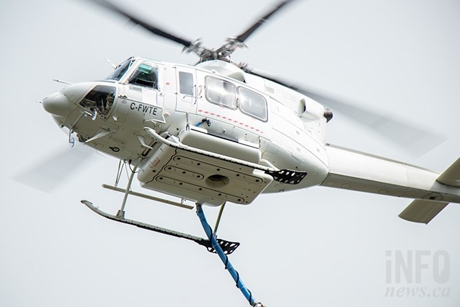 One of two helicopters fighting the Buse Creek wildfire east of Kamloops on May 12, 2019.