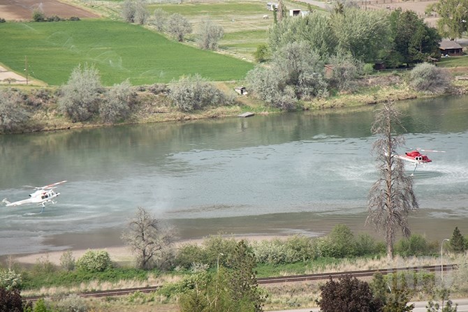 The helicopters fill their tanks in the nearby South Thompson River.