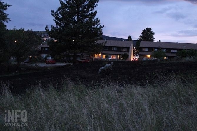 The aftermath of a grass fire behind an apartment building near Sa-Hali Secondary School on June 2, 2019.