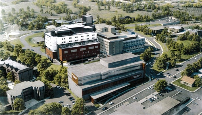 The nine storey building will tower over the rest of the hospital and feature a heliport.