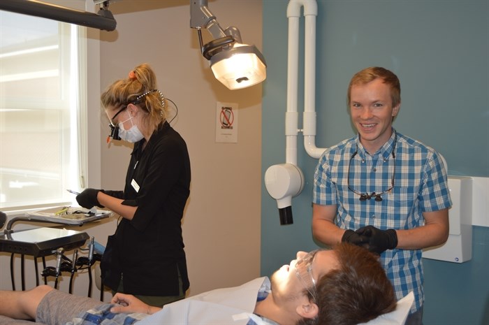 Volunteer Dentist and Oral Surgeon, Dr. Scott Martyna works on a patient in the Gospel Mission's dental clinic.