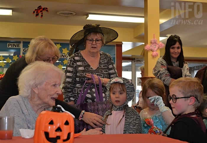 Children went around to the seniors and recieved goody bags from each of them.