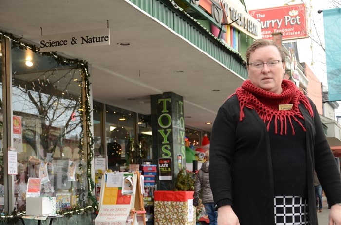 Vernon Teach and Learn owner Lynella Henke stands in front of her downtown store near where Frosty the Snowman once stood. She's not happy she was told he had to go.