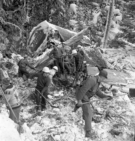 Rescue workers search for victims in the rubble near the remains of a tanker truck caught in the onslaught.